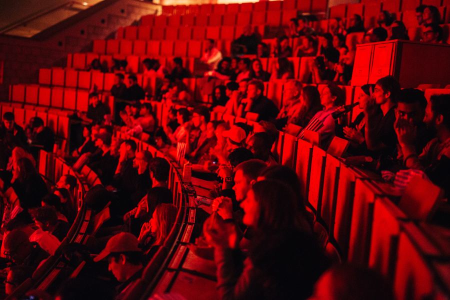 A red-lit auditorium during a Movie Sprint screening.
